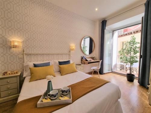 Postel nebo postele na pokoji v ubytování APARTAMENTOS SAN ANDRES
