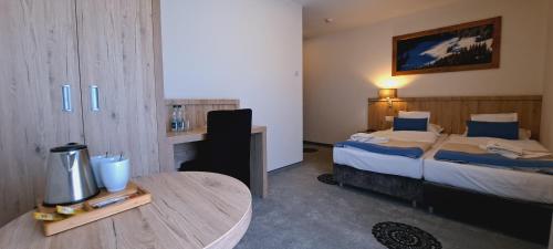Grand Tatry - miejsce na wyjątkowy pobyt dla Ciebie i Twojej rodziny! - sauna i jacuzzi wliczone w cenę pobytu - 10 minut pieszo od Term Baniaにあるベッド