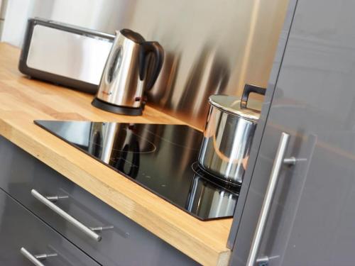 Kuchyň nebo kuchyňský kout v ubytování Appartements Rue Lemoine XXL