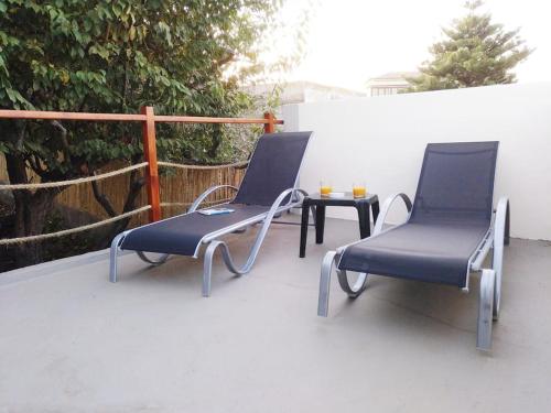 two chairs and a table on a patio at Casa Nogal in La Matanza de Acentejo