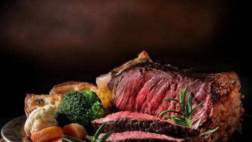 a plate of food with meat and vegetables on it at Lady Gregory Hotel, Leisure Club & Beauty Rooms in Gort