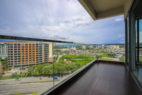 a balcony with a view of a city at AJ Suites @ Loft Imago KK in Kota Kinabalu