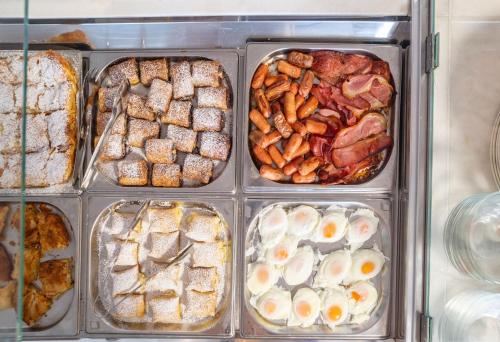 a display case filled with different types of food at Marelina Villas in Panormos Rethymno