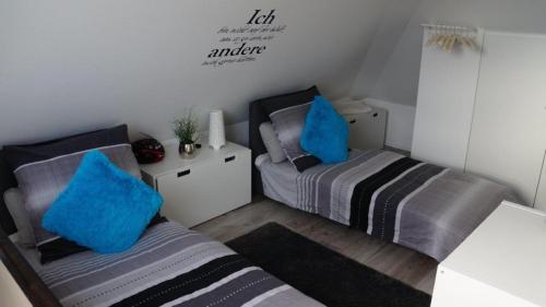 Łóżko lub łóżka w pokoju w obiekcie Sonnendeck 36 - Großenbrode