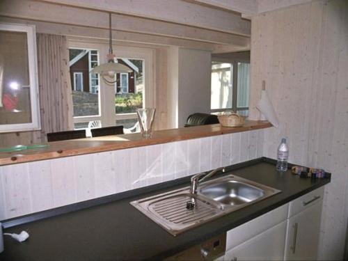 a kitchen with a sink and a counter top at Haus Landseer - Baabe in Baabe