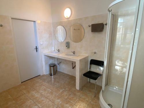 a bathroom with a sink and a shower at Penzion Zahrada Čech in Litoměřice