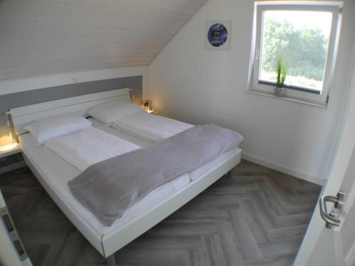 Postel nebo postele na pokoji v ubytování Strandkorb - Nordhorn - a69868