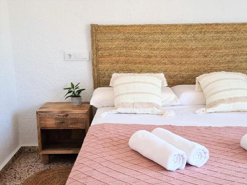 a bed with two pillows on it in a room at La Renda Mediterranean Villa - Beach, Jávea Port and amenities within walking distance in Jávea