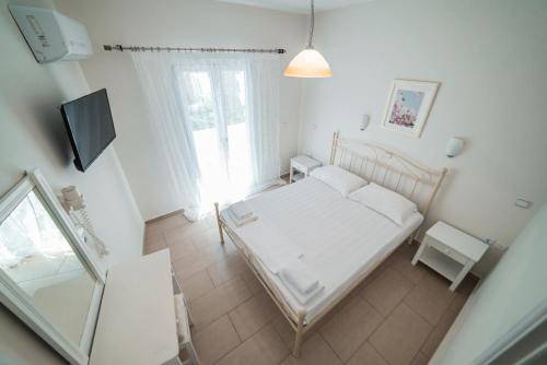 Ένα ή περισσότερα κρεβάτια σε δωμάτιο στο Hotel Sagterra 
