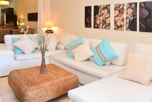 A seating area at Ground floor Oceanfront El Faro Condo, Great for Families Coral 101
