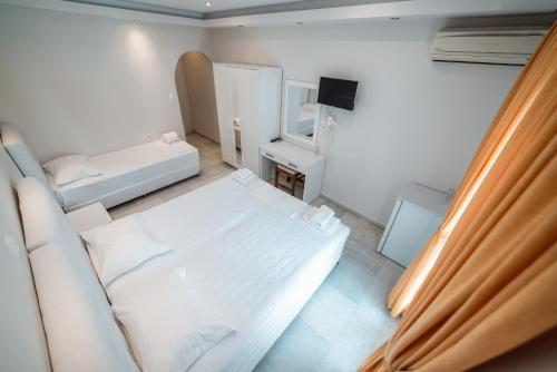 Ένα ή περισσότερα κρεβάτια σε δωμάτιο στο Hotel Sagterra 