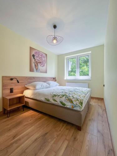 Posteľ alebo postele v izbe v ubytovaní Apartament Ptasi Śpiew