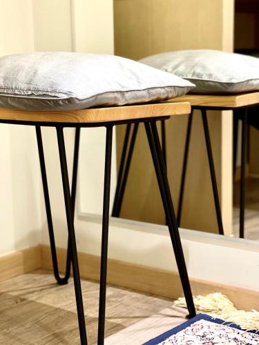 a table with a pillow on top of it at House of A&Arwen in Sarandë