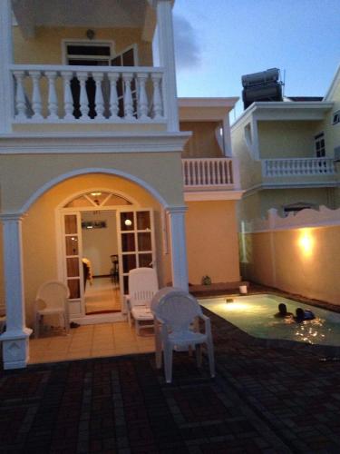 a house with a swimming pool in front of it at Villa Pereybere #2 in Pereybere