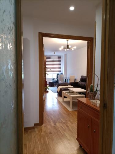 a living room with a couch and a table at Apt. Descenso del Sella, Arriondas in Arriondas