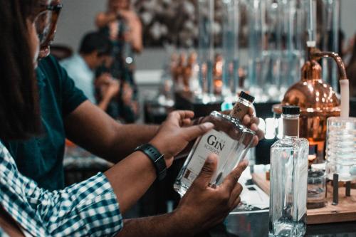 a group of people sitting at a bar with a drink at Indaba Hotel, Spa & Conference Center in Johannesburg