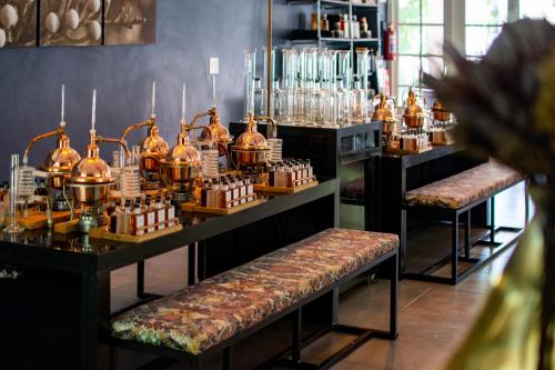 a room with a bar with a bunch of bottles at Indaba Hotel, Spa & Conference Center in Johannesburg