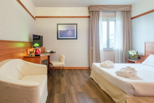 SHG Hotel Bolognaにあるベッド