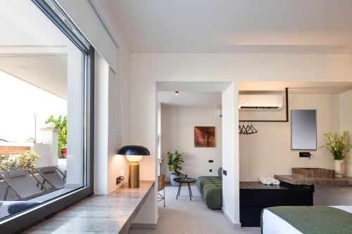 a room with a view of a living room at Aristea Hotel in Rethymno Town