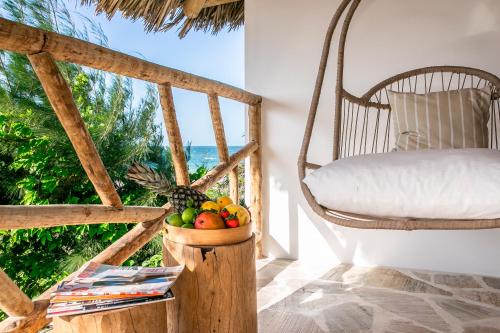a bowl of fruit on a table in a room with a window at Preabeach Boutique Hotel & SPA in Prea