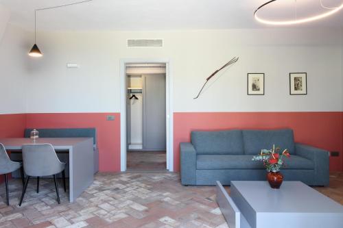 a living room with a couch and a table at Laqua Vineyard in Terricciola