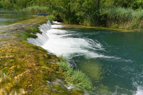 a river with rapids on the side of it at Lavanda Land - Villa Tanya Mrežnica in Donji Zvečaj
