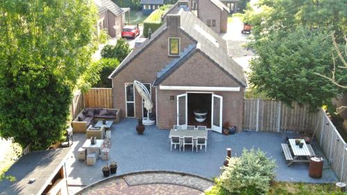 an aerial view of a backyard with a patio at Recreatiewoning Maas en Waal 191 in Ewijk