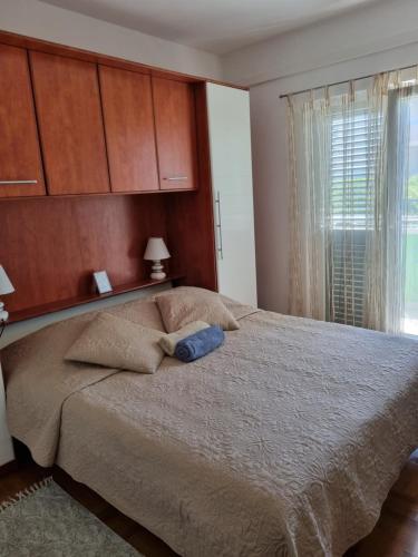 Ένα ή περισσότερα κρεβάτια σε δωμάτιο στο Sveti Filip Jakov