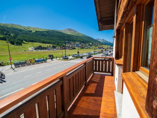 a balcony of a house with a view of a street at Chalet Irene Livigno in Livigno