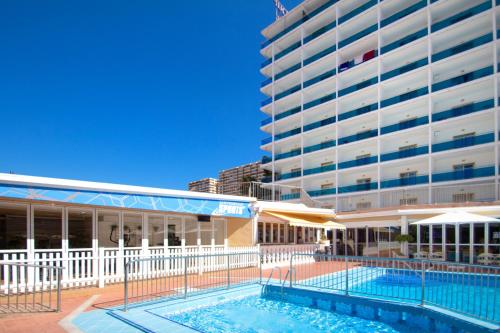a building with a pool in front of a building at Hotel Servigroup Nereo in Benidorm