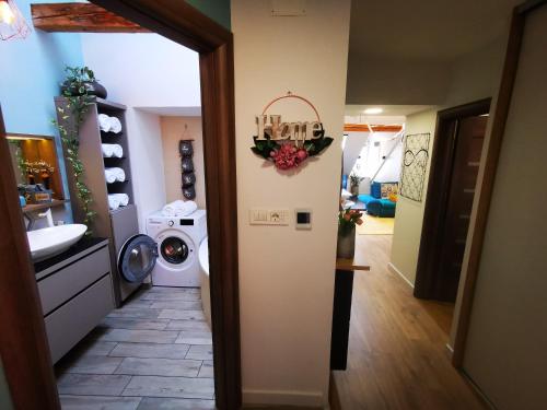 a hallway with a washer and dryer in a house at Apartment Keleia in Celje