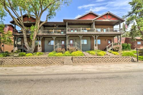 a house on the side of the street at Walkable Bigfork Townhome Fish, Hike and Ski! in Bigfork