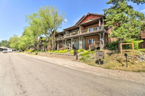 a house sitting on the side of a road at Walkable Bigfork Townhome Fish, Hike and Ski! in Bigfork