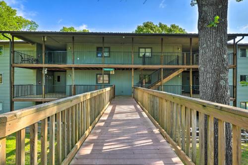 a boardwalk leading to the front of a building at Reeds Spring Condo Near Aquarium at the Boardwalk! in Reeds Spring