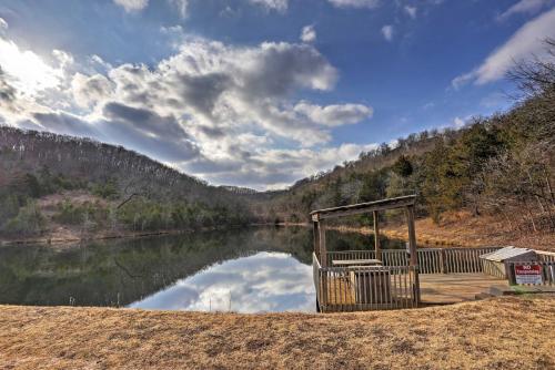 a view of a lake with a gazebo at Reeds Spring Condo Near Aquarium at the Boardwalk! in Reeds Spring
