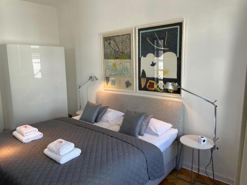 a bedroom with a bed with two towels on it at Apartment Factory in Hamburg