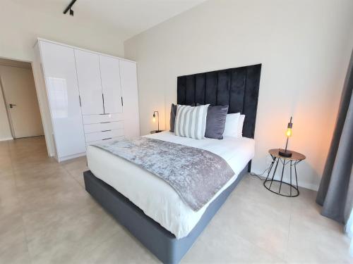 Katil atau katil-katil dalam bilik di MINT Apartments Greenside