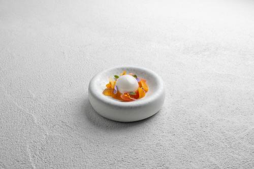a small white bowl with an egg in it at Lefay Resort & Spa Lago Di Garda in Gargnano