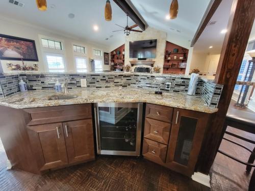a large kitchen with a large counter top at Newly Renovated Private Ranch Get-A-Way in Pilot Point