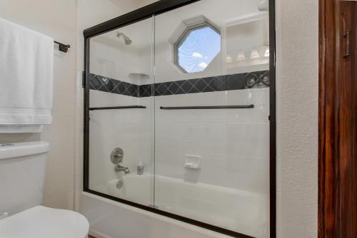 a glass shower in a bathroom with a toilet at Newly Renovated Private Ranch Get-A-Way in Pilot Point