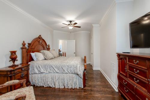 a bedroom with a bed and a flat screen tv at Newly Renovated Private Ranch Get-A-Way in Pilot Point
