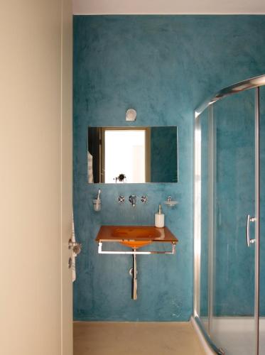 a bathroom with a sink and a shower at Villa Aiolos: above the sea, within Agios Nikolaos in Agios Nikolaos