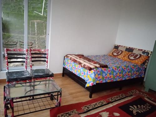 Cama o camas de una habitación en Jandyal Farm House