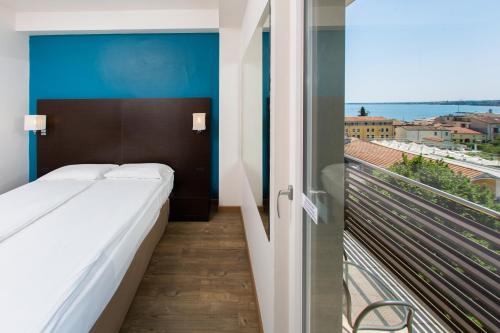 Postel nebo postele na pokoji v ubytování Hotel Bonotto