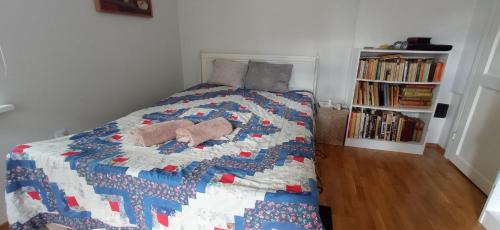 a bedroom with a bed with a quilt on it at Herne Homestay in Tallinn