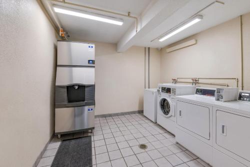 a kitchen with a washer and dryer in it at Red Roof Inn Philadelphia - Trevose in Trevose