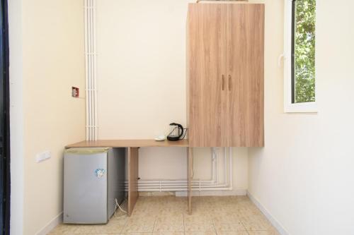a desk in a room next to a window at Forest Hills in Yerevan