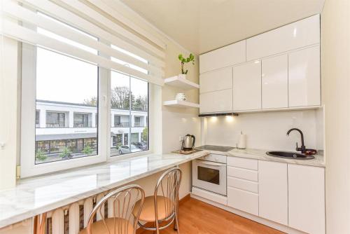 Кухня или мини-кухня в Apartamentai Druskininku centre
