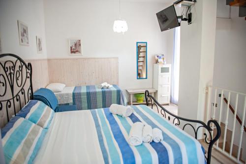 Ένα ή περισσότερα κρεβάτια σε δωμάτιο στο Vacanze al San Domenico