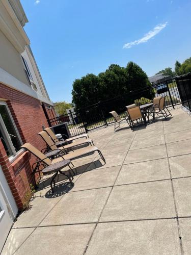 a group of chairs sitting on a patio at Holiday Inn Express & Suites Niagara Falls by IHG in Niagara Falls